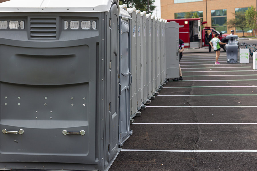 portable toilets in the parking lot